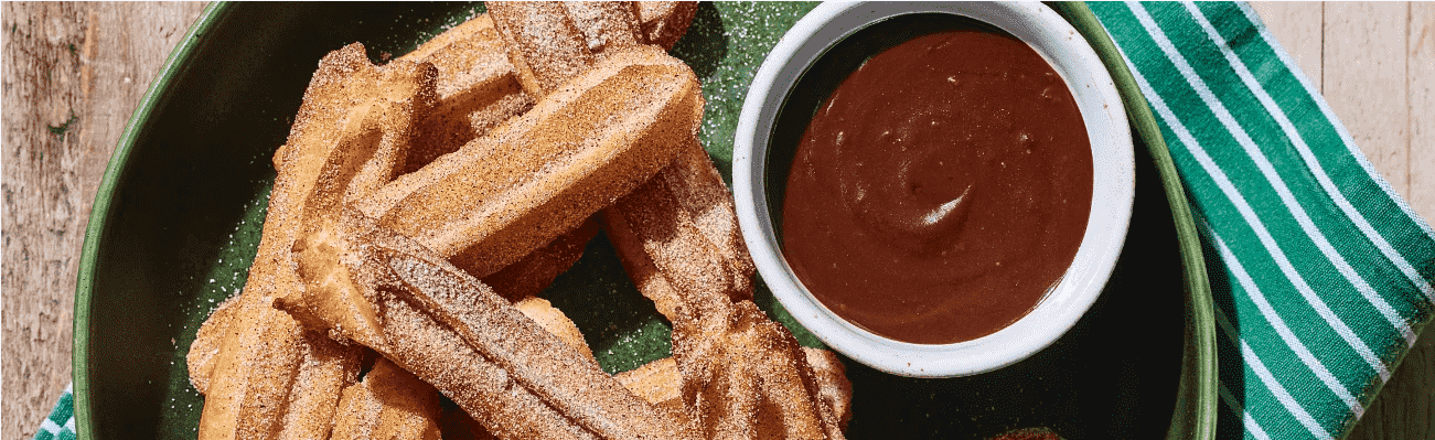 Baked Churros with Chocolate Beer Sauce.png